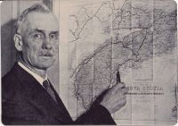 Frederick Blair pointing to Oak Island on map