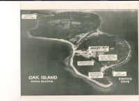 1965 aerial photo of Oak Island on an angle with view of future causeway - labeled
