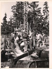Preparing to be lowered in with view of machine behind group