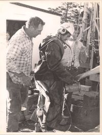 Blankenship being handed flashlight